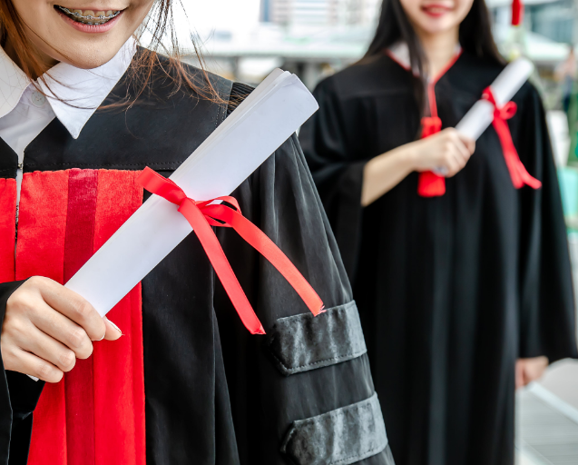 University students graduation holding diploma
